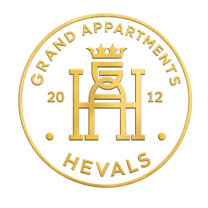 Hevals Grand Apartments Logo